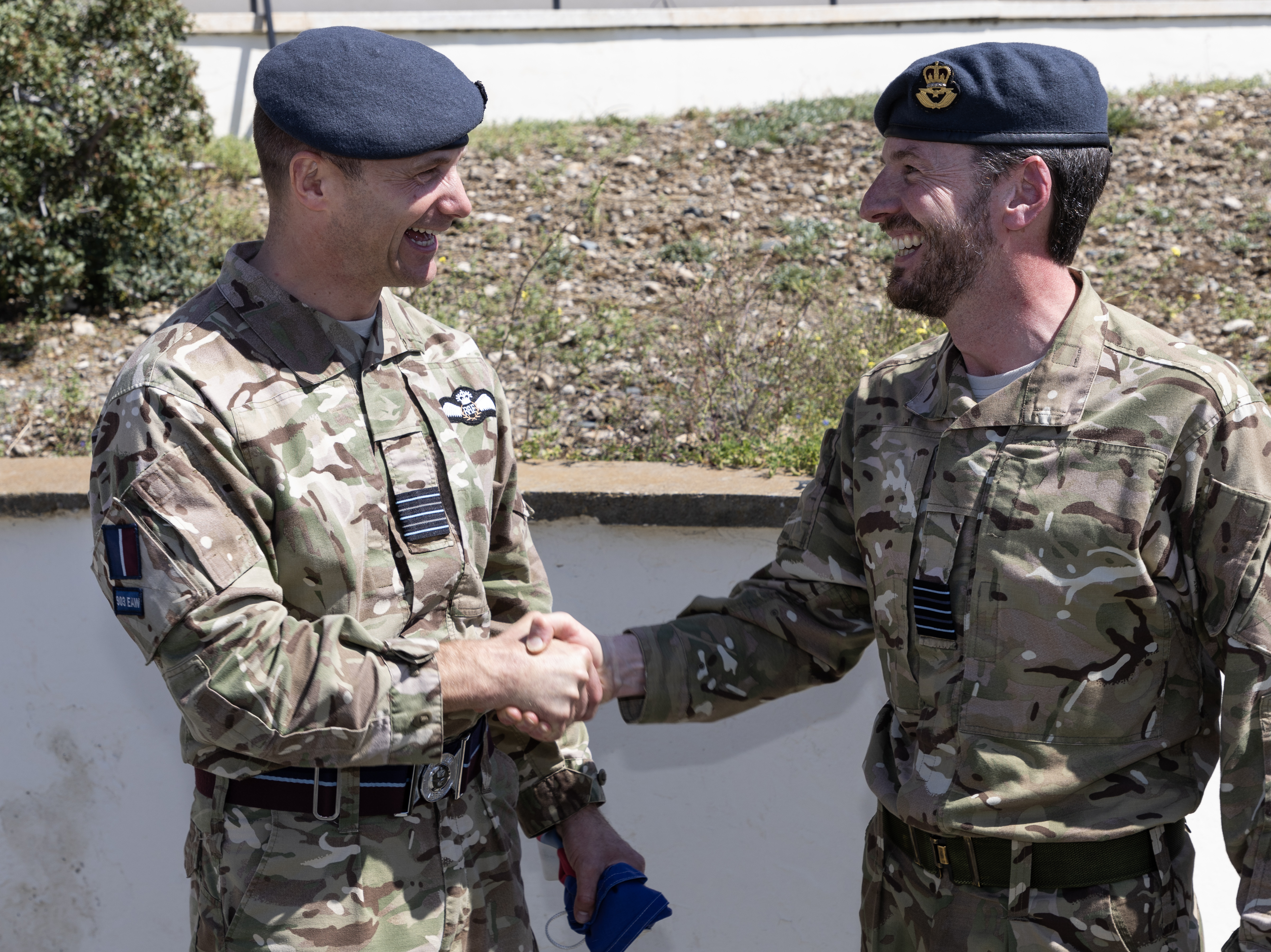 Image shows RAF personnel shaking hands.